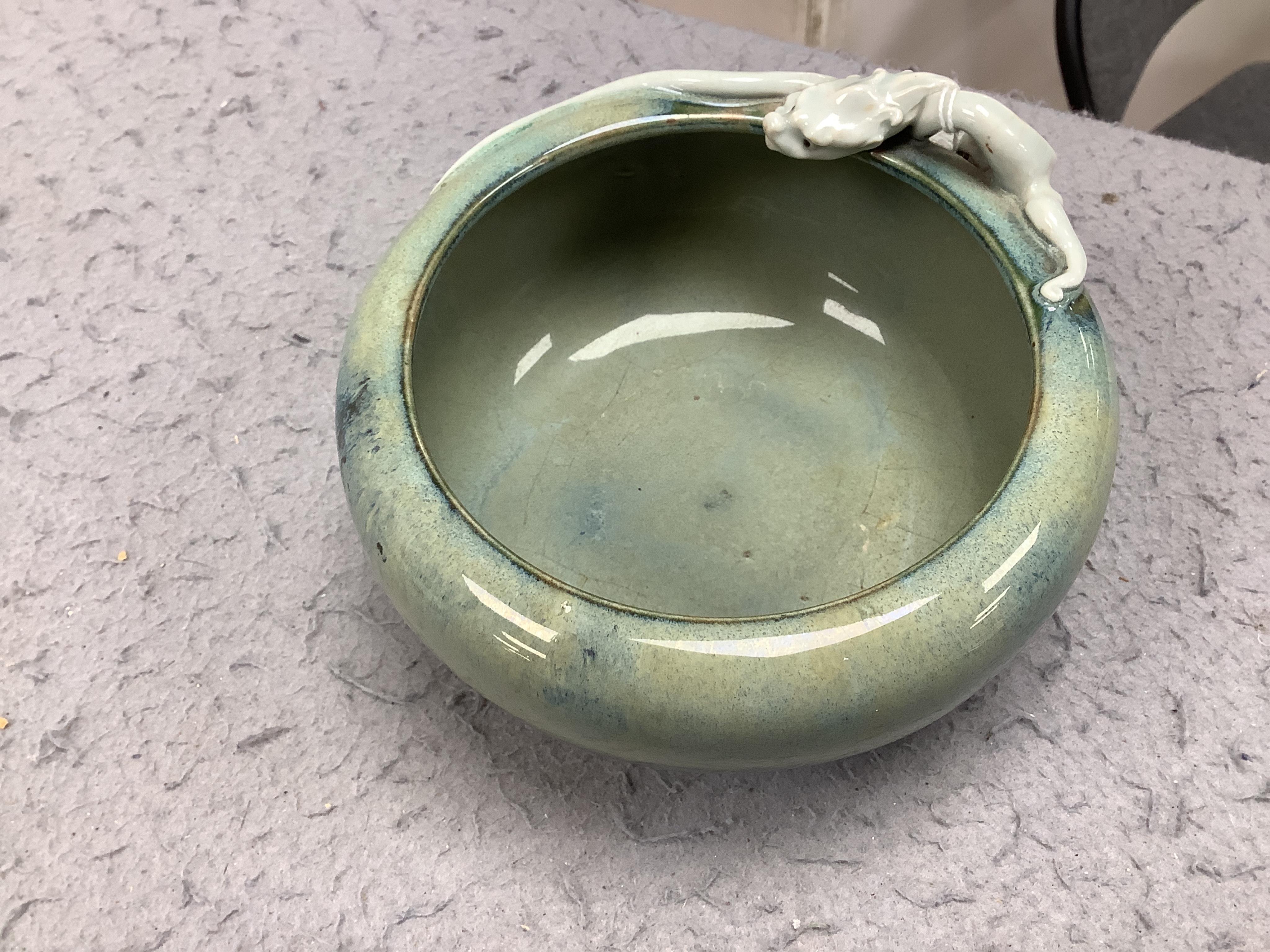 A Japanese Sumidagawa ware ‘dragon’ bowl, Meiji period, signed Ishiguro Koko, wood stand. Condition - scratching and crazing to the glaze on the interior otherwise good.